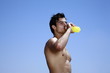 Photo: Male young adult drinking juice Male young adult drinking juice
