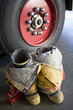 Empty firefighter's boots and uniform next to fire engine