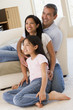 Photo: Family in living room smiling Family in living room smiling