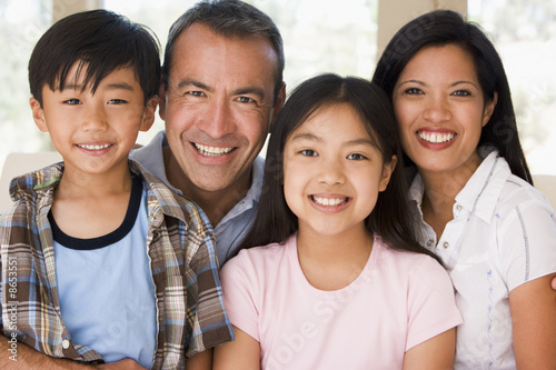 Photo: Family in living room smiling Family in living room smiling