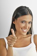 "Female young adult;thumbs up"