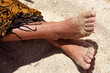 Woman's bare feet on sand