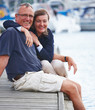 Old man with old woman at dock