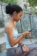 Beautiful young teenager reading a text message Beautiful young teenager reading a text message