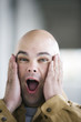 Portrait of a surprised bald headed man.