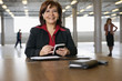 Photo: Portrait of a cheerful business woman holding pda. Portrait of a cheerful business woman holding pda.