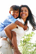Mother Playing with Son with Piggyback Ride