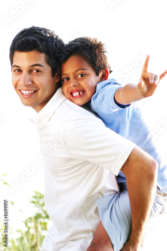 Photo: Father & Son Playing Together Outdoors Father & Son Playing Together Outdoors