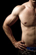 Muscular guy on black background