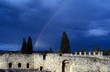 Rainbow over old stone building