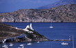 Boats in the water on island coast