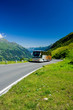 Bus on a road in Alps