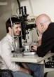 Optometrist examining patient