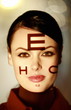 Woman with optical exam characters on her face