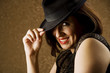Hispanic Woman Tipping Her Hat