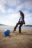Photo: Businessman on beach with globe beach ball *** Local Caption *** Accuracy, Balance and Freedom are some of the global business concepts depicted here by the sea. Businessman on beach with globe beach ball *** Local Caption *** Accuracy, Balance and Freedom are some of the global business concepts depicted here by the sea.