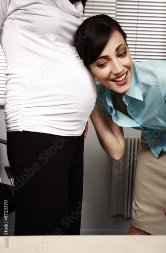 Photo: Office worker guessing the sex of colleague's baby Office worker guessing the sex of colleague's baby