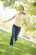 Woman running outdoors smiling
