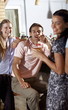Two women and a man in a bar