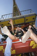 Teenagers on amusement park ride