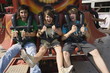 Teenagers on amusement park ride