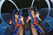 Two female teenagers on amusement park ride