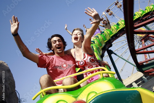 Photo: Teenage couple on amusement park ride Teenage couple on amusement park ride