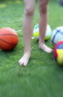 Photo: Child's legs with balls Child's legs with balls