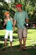 Father and daughter with baseball outfit