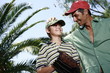 Father and son with baseball caps and glove