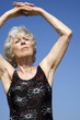 Female senior stretching