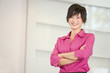 Businesswoman standing indoors smiling