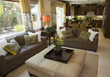 Living room with kitchen in the background.