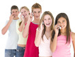 Row of five friends on cellular phones smiling