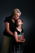 grandmother kissing and hugging granddaughter grandmother kissing and hugging granddaughter