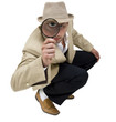 sitting detective with magnifier.