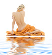beautiful lady with orange towels on white sand