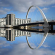 Quadro new bridge reflected in river Clyde Glasgow Scotland Quadro new bridge reflected in river Clyde Glasgow Scotland