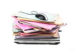 Stack of folders with laptop computer and a computer mouse Stack of folders with laptop computer and a computer mouse