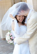 beautiful young bride and groom stand together
