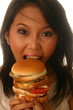 Woman eating hamburger