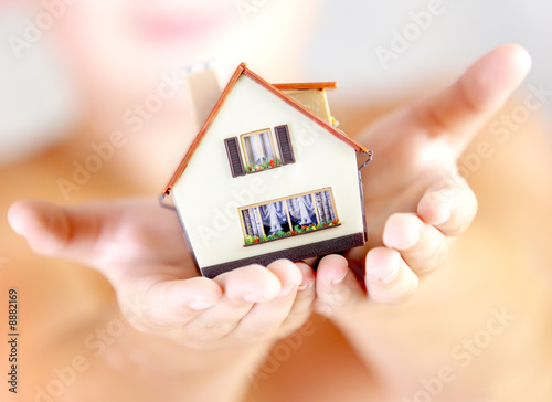 Photo: The house in human hands The house in human hands
