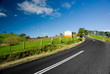 Road winding through country meadows