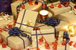 Christmas presents and candles under the tree Christmas presents and candles under the tree
