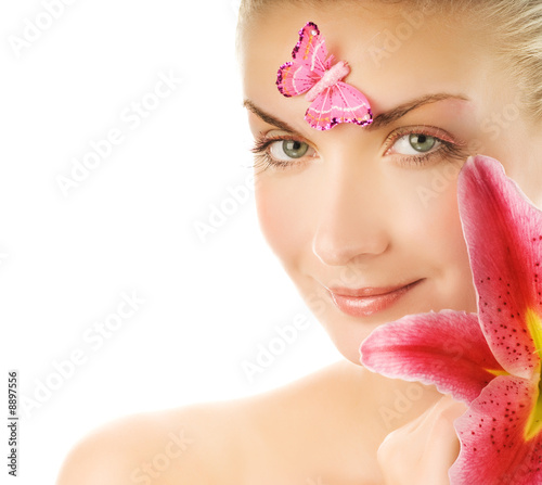 Beautiful young woman with pink lily close-up portrait Beautiful young woman with pink lily close-up portrait