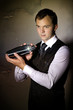 Barkeeper with wall background holding shaker