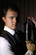 Barkeeper with wall background holding shaker