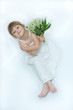 little, pretty girl holding bunch of lilies of the valley little, pretty girl holding bunch of lilies of the valley
