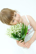 little, pretty girl holding bunch of lilies of the valley little, pretty girl holding bunch of lilies of the valley