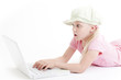 Young girl using a laptop computer over white background
